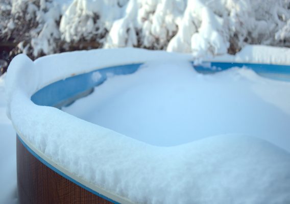 Why You Should Remove Snow From Your Pool Cover