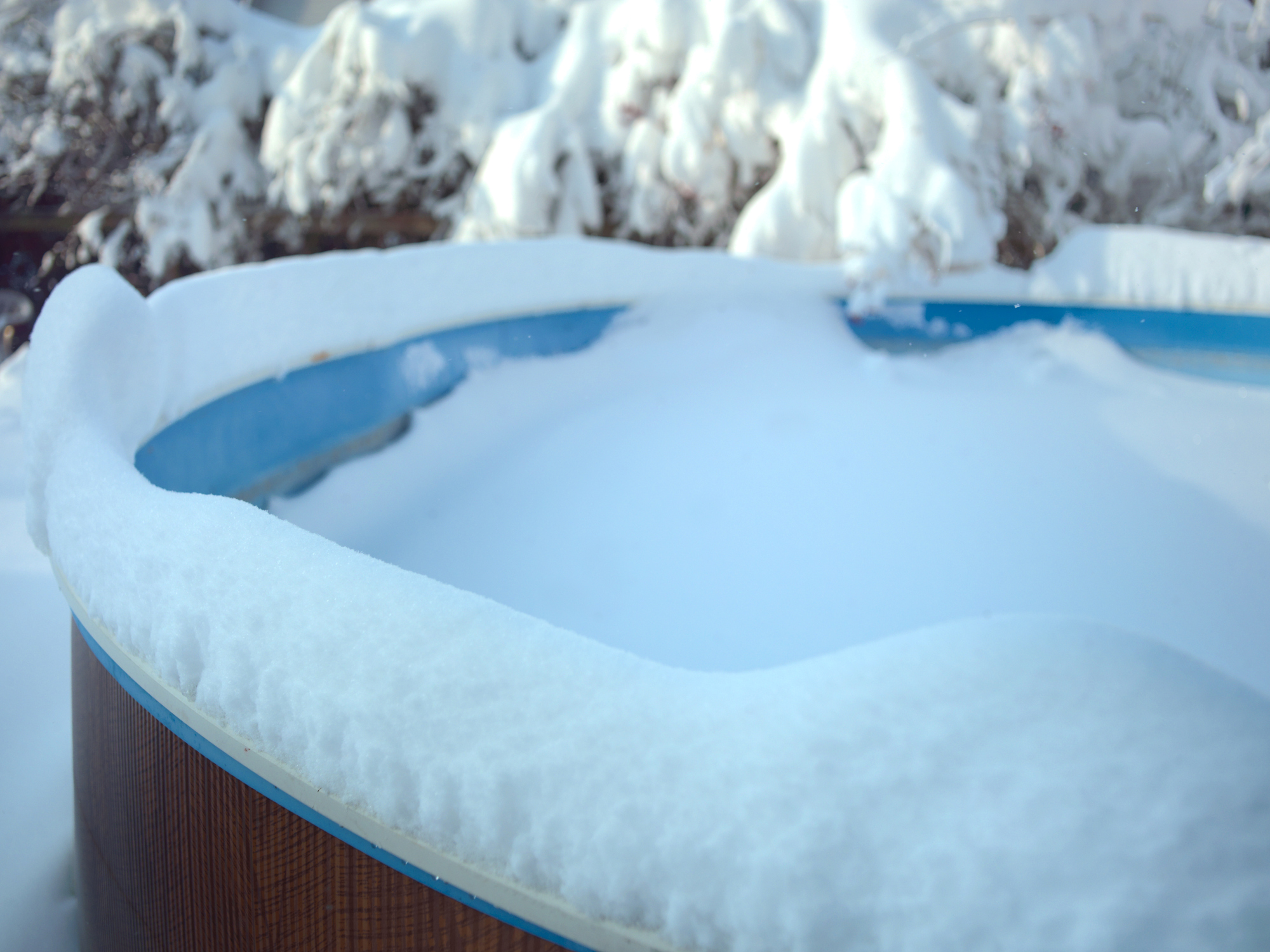 Why You Should Remove Snow From Your Pool Cover